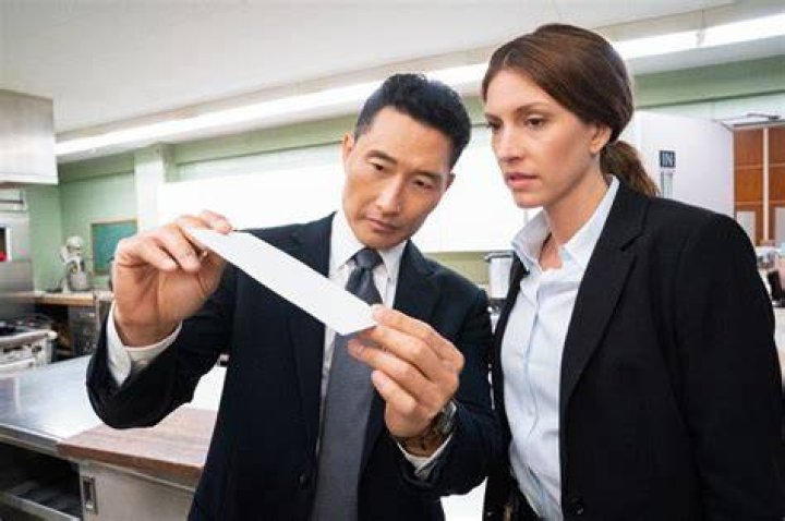 Agent Dani Toretti and Special Agent Matthew Ryker, played by Dawn Olivieri and Daniel Dae Kim, examine the Daschle letter. (National Geographic/Peter Stranks)