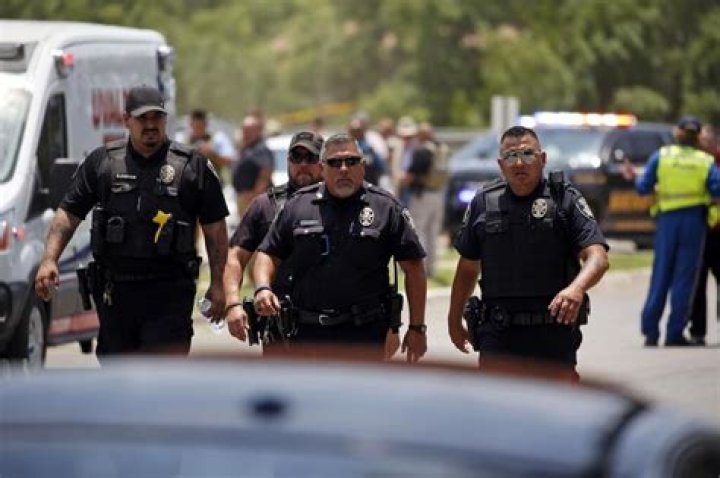 Police walk near Robb Elementary School following a shooting, in Uvalde, Texas Texas School-Shooting, Uvalde, United States - 24 May 2022