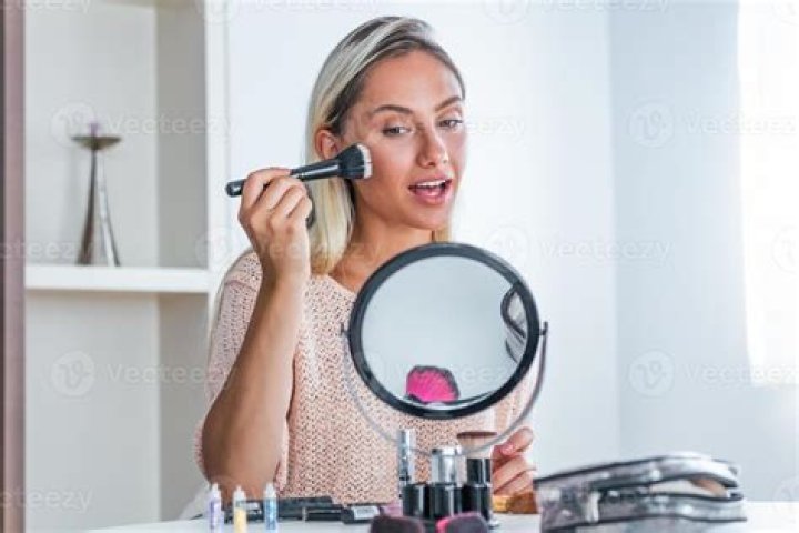 Woman doing her makeup